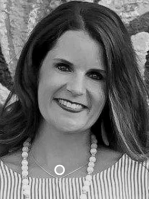 Laura King Headshot - Woman with light skin and long dark hair