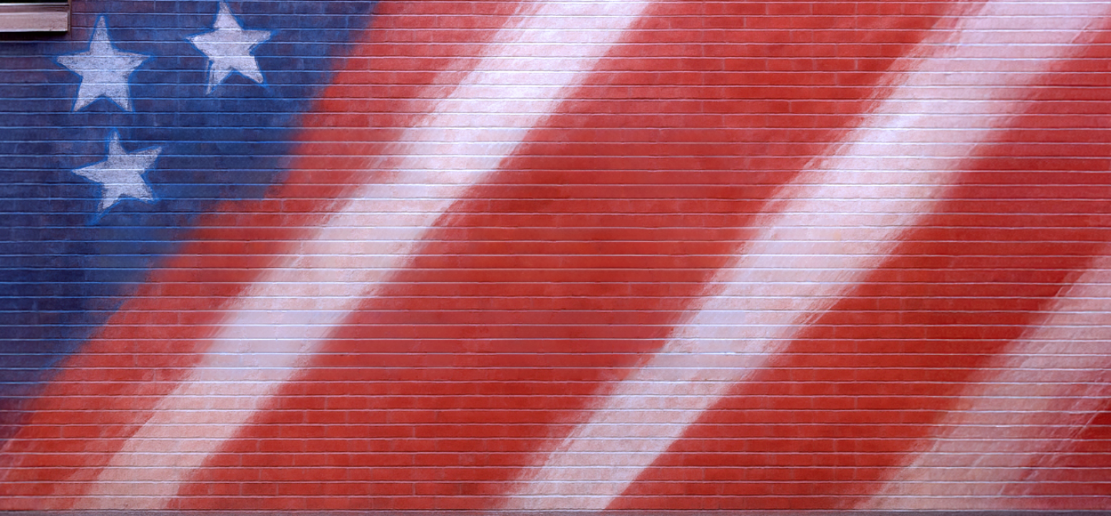 Mural showing part of American flag painted on bricks